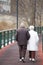 An elderly couple walking along a path. La Vella city, Andorra