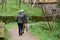 Elderly couple walking along the path in the park