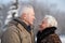 Elderly couple in winter park