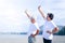 Elderly couples exercise in the morning on the beach by the sea