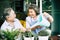 Elderly couples talking together and plant a trees