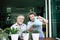 Elderly couples talking together and plant a trees