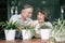 Elderly couples talking together and plant a trees