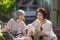 Elderly and daughter reading a book together for improves memory and helps prevent dementia