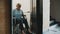 Elderly disabled woman using the lift in the wheelchair