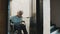 Elderly disabled woman using the lift in the wheelchair. Slow motion