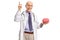 Elderly doctor pointing up and holding a brain model