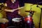 An elderly drummer plays in a recording Studio. A man of age sitting behind a drum set with sticks in his hands