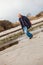 Elderly energetic man running along a beach