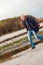 Elderly energetic man running along a beach