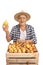 Elderly farmer with a crate full of pears isolated