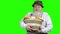 Elderly farmer with dairy products on green screen.