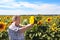 Elderly farmer and sunflowers