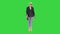 Elderly fashionable woman in a suit walking on a Green Screen, Chroma Key.