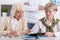 Elderly female friends studying together