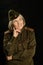 Elderly female soldier on a black background