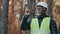 Elderly forestry engineer professional shares experience assesses environment an foreman supervises felling of emergency