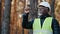 Elderly forestry engineer professional shares experience assesses environment an foreman supervises felling of emergency