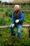 Elderly gardener enjoying vegetable garden