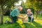 Elderly gardeners couple, apple basket.