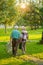 Elderly gardeners couple, back view.