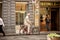 Elderly gentleman getting on his bicycle outside a bakery Florence