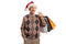 Elderly gentleman with a santa claus chrostmas hat holding shopping bags