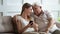 Elderly grandfather and adult granddaughter having fun use mobile phone