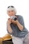 Elderly happy woman with a camera for a photo on vacation and travel. Grandma, Mom. Active pension. Birthday, mother`s day, family