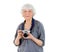 Elderly happy woman with a camera for a photo on vacation and travel. Grandma, Mom. Active pension. Birthday, mother`s day, family