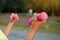 The elderly hold a pink dumbbell to exercise