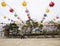 Elderly korean man walking under colorful paper lanterns