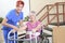 Elderly lady with her physiotherapist in a