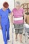Elderly lady with her physiotherapist in a