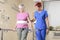 Elderly lady with her physiotherapist in a