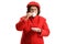 Elderly lady in a red coat taking a sip of espresso coffee