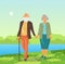 Elderly loving couple man and woman walk in park near the lake holding hands. Walking in city park in warm summer weather. Elderly