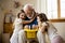 Elderly magician with his cute granddaughters stock photo