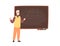 Elderly male college teacher, university professor, lecturer or educational worker standing beside chalkboard, holding