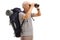 Elderly male hiker looking through binoculars