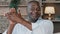 Elderly male portrait African American brunette man with wrinkles smiling congratulating applauding ethnic senior