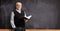 Elderly male teacher holding a book