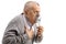 Elderly man with asthma using an inhaler and holding his chest