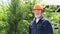 Elderly man with a beard in protective helmet and goggles.