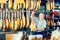 Elderly man buying tasty jamon leg in store