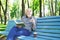 Elderly man in casual reading outdoors