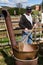 An Elderly Man Cooking a Kettle of Apple Butter