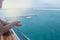 An elderly man on a cruise ship looks at the panorama of the port of Valencia. Kind of luxurious and leisure, the concept of sea