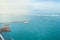 An elderly man on a cruise ship looks at the panorama of the port of Valencia. Kind of luxurious and leisure, the concept of sea