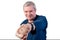 An elderly man demonstrates fist fight. Isolated on a white background